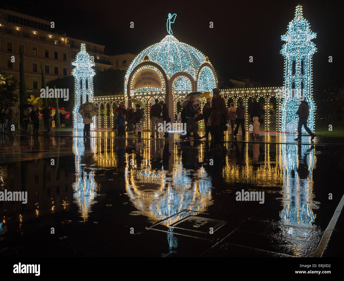 Light installation of Christmas palace refelcted in Nice's Miroir d'eau at Promenade du Paillon Stock Photo