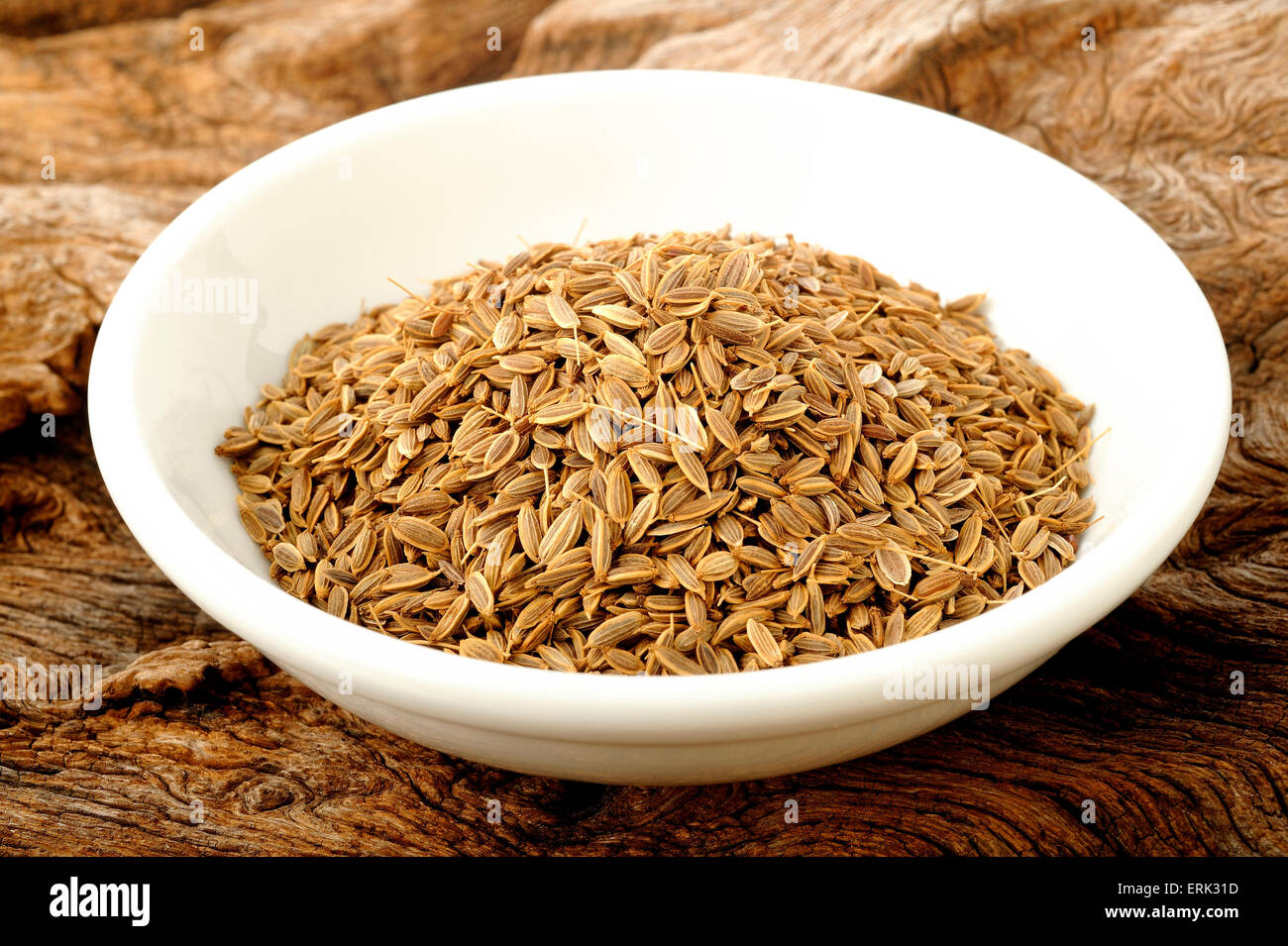 dill seeds in white bowl Stock Photo Alamy