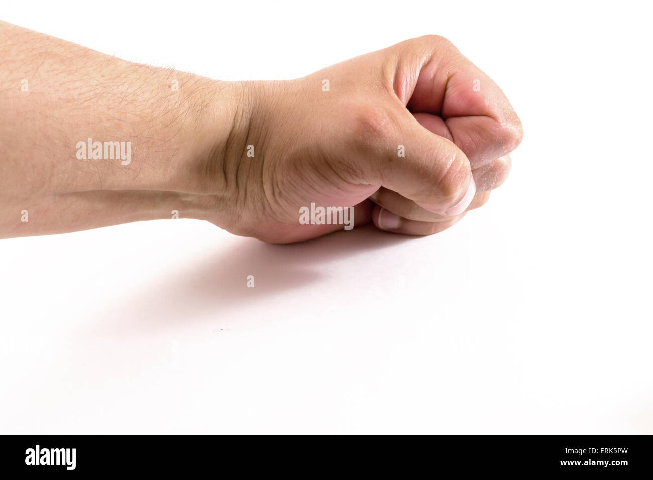 White male clenching a fist and smashing a white background Stock Photo