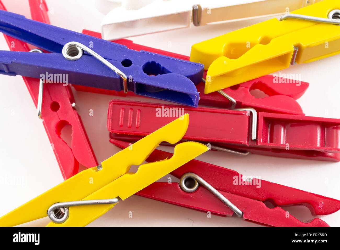 Plastic pegs in a group on a white background Stock Photo Alamy