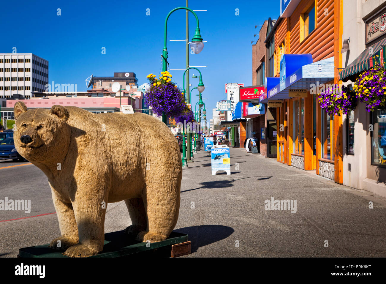 A large stuffed bear on 4th Ave in downtown Anchorage under blue sky, Southcentral Alaska, Summer. Stock Photo