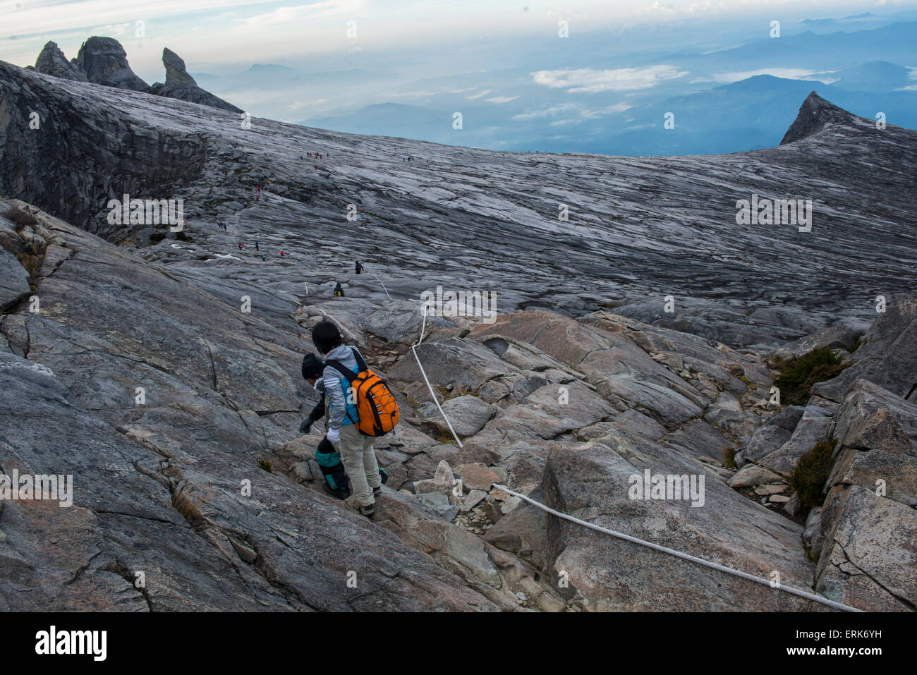 Guide and girl walks on the peak, Low's Peak, Mount Kinabalu, Sabah ...