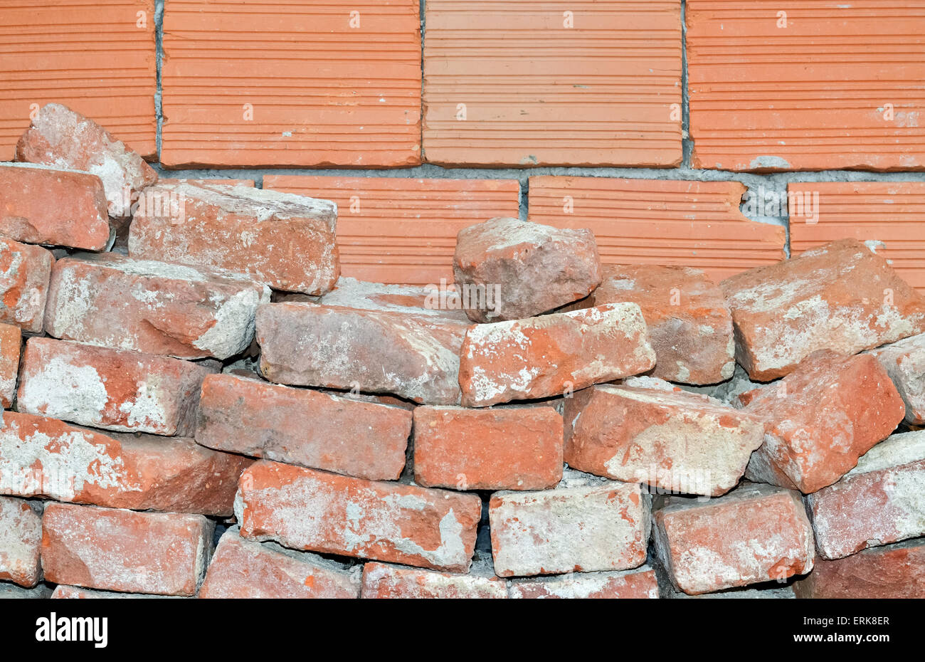 Closeup of old broken bricks and wall made of new red bricks Stock Photo Alamy