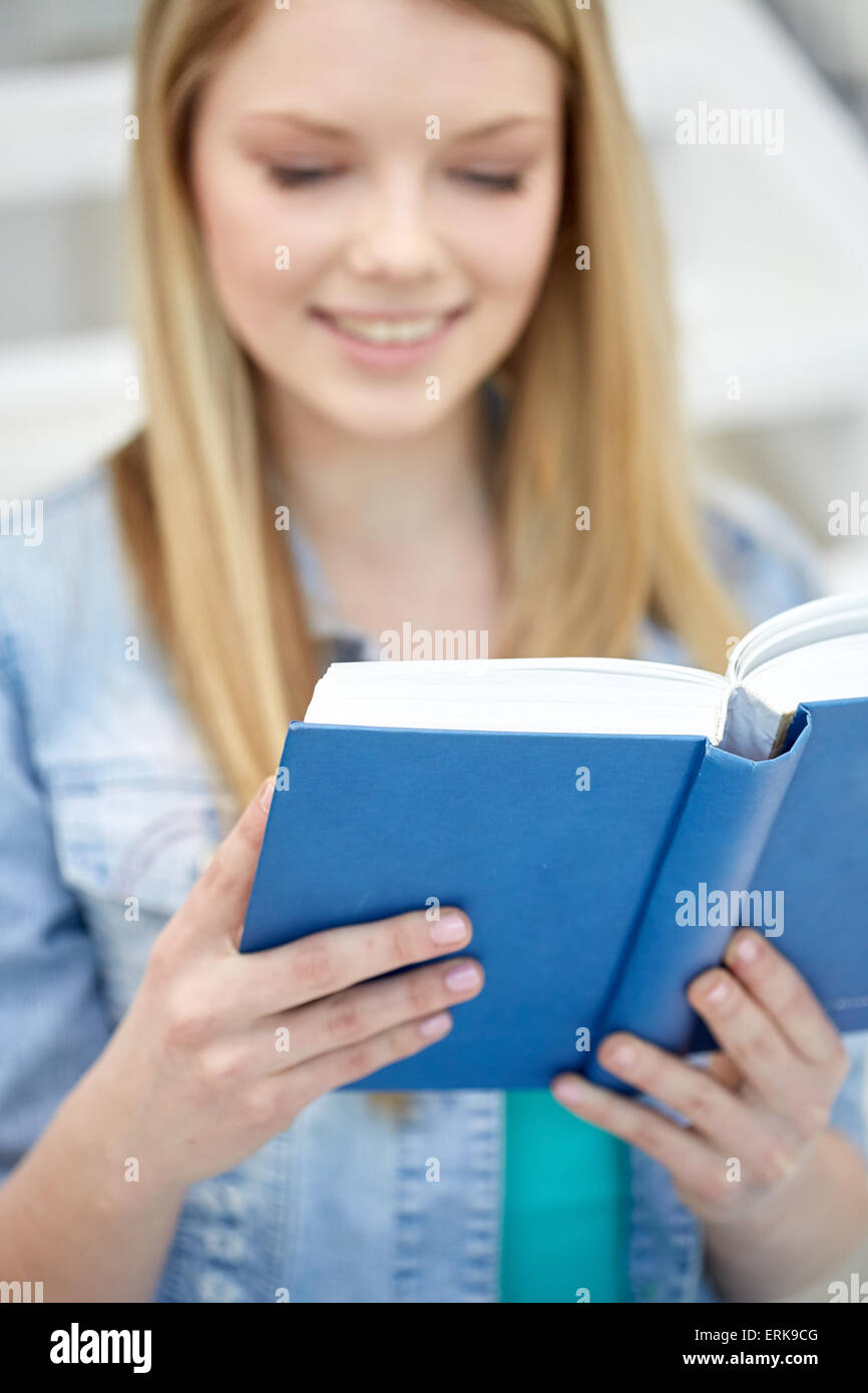 close up of young woman reading book at school Stock Photo - Alamy