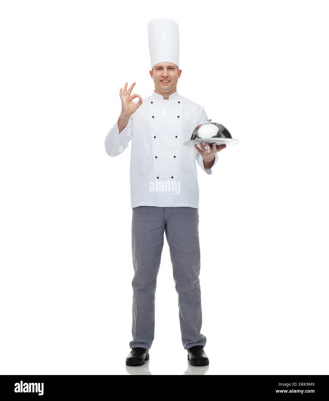 happy male chef cook with cloche showing ok sign Stock Photo