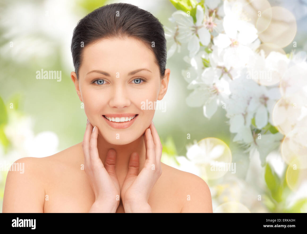 beautiful young woman touching her face and neck Stock Photo - Alamy