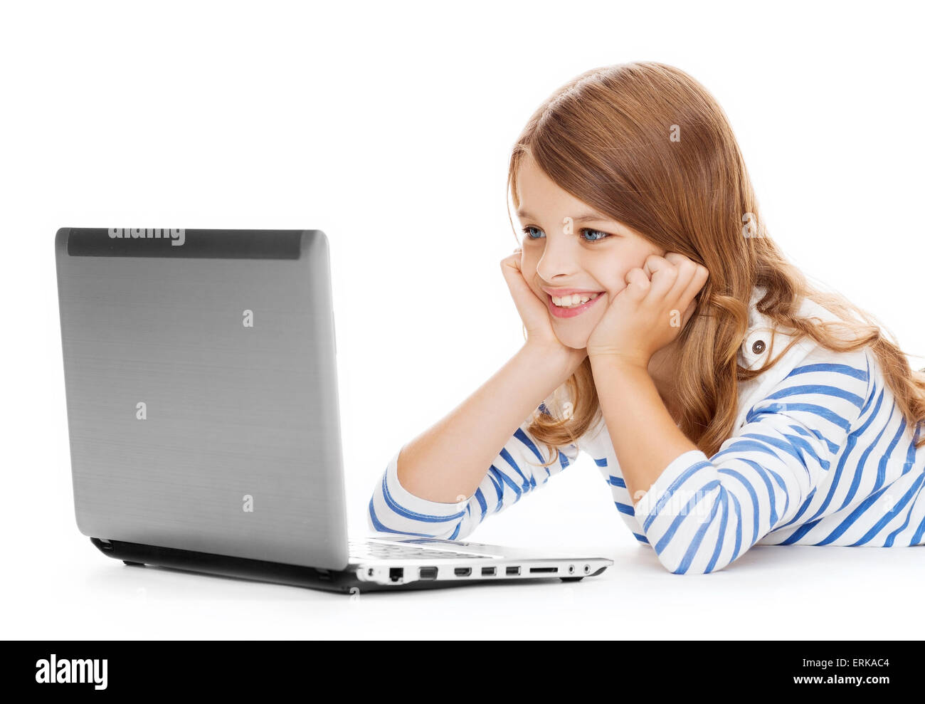 smiling student girl with laptop computer lying Stock Photo
