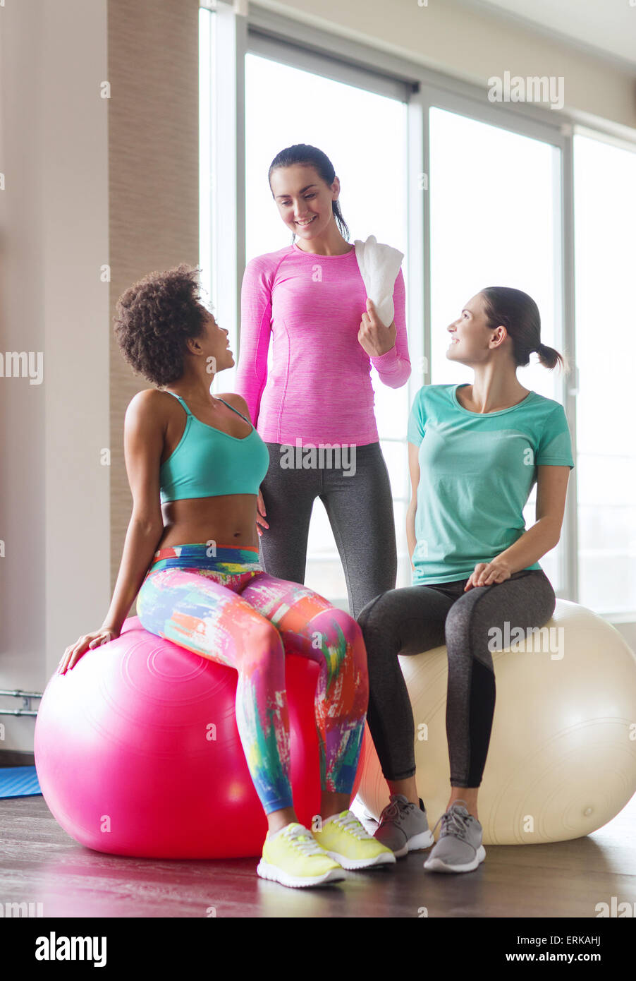 group of smiling women with exercise balls in gym Stock Photo Alamy