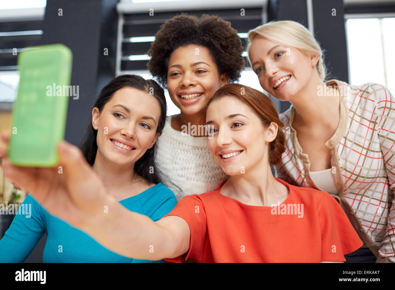 happy young women taking selfie with smartphone Stock Photo - Alamy