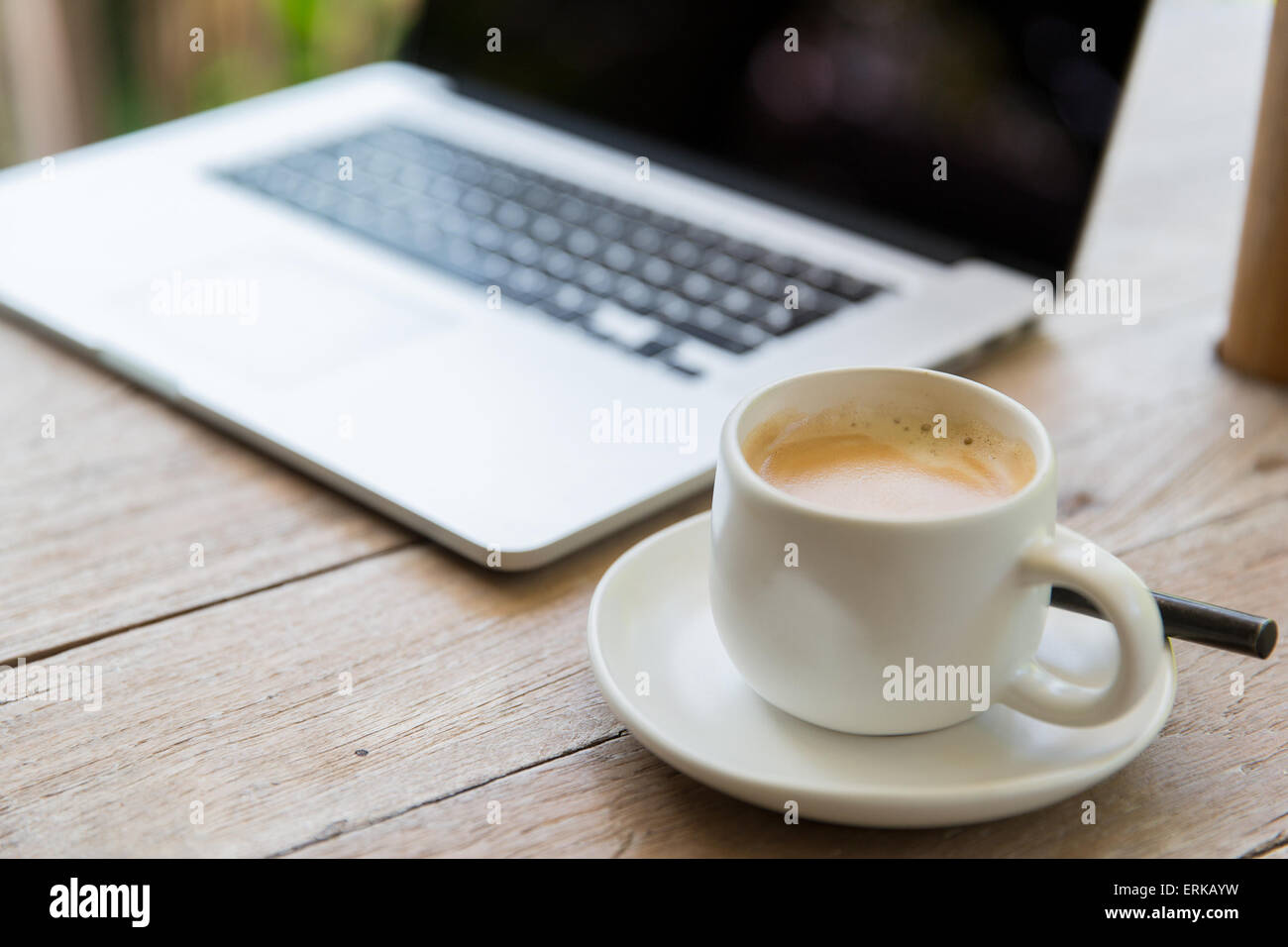 close up of laptop and coffee cup on office table Stock Photo - Alamy