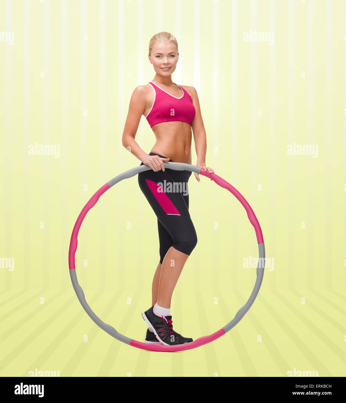 young sporty woman with hula hoop Stock Photo