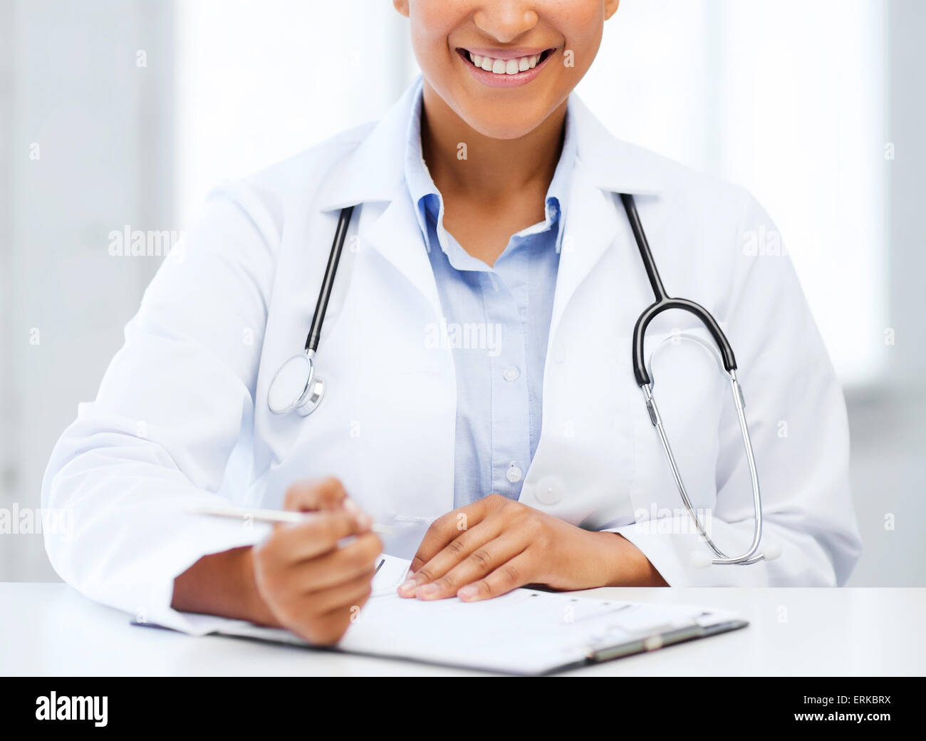 female doctor writing prescription Stock Photo - Alamy