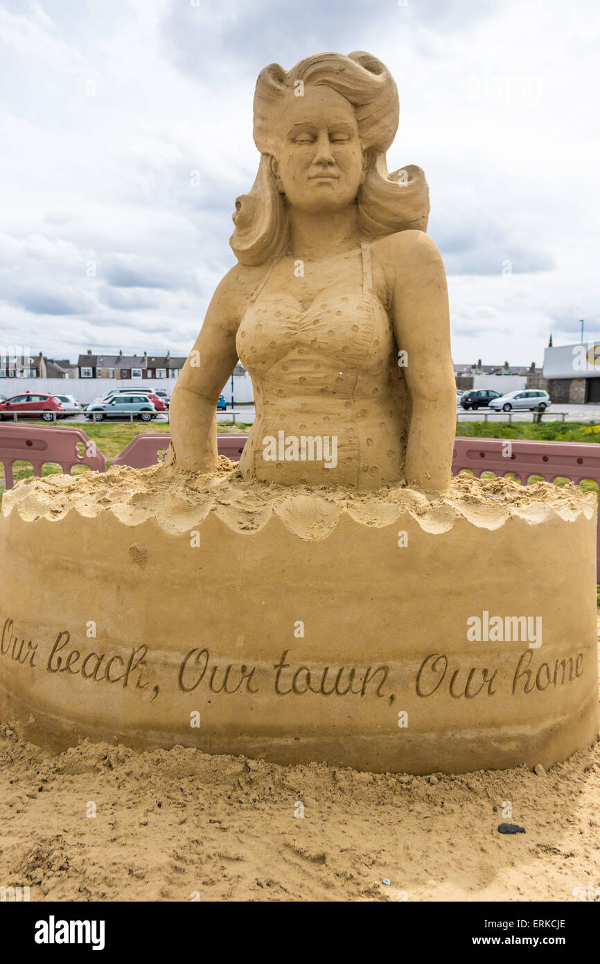 Sand sculpture of a woman in a swimming costume promoting the town of Redcar Cleveland England UK Stock Photo