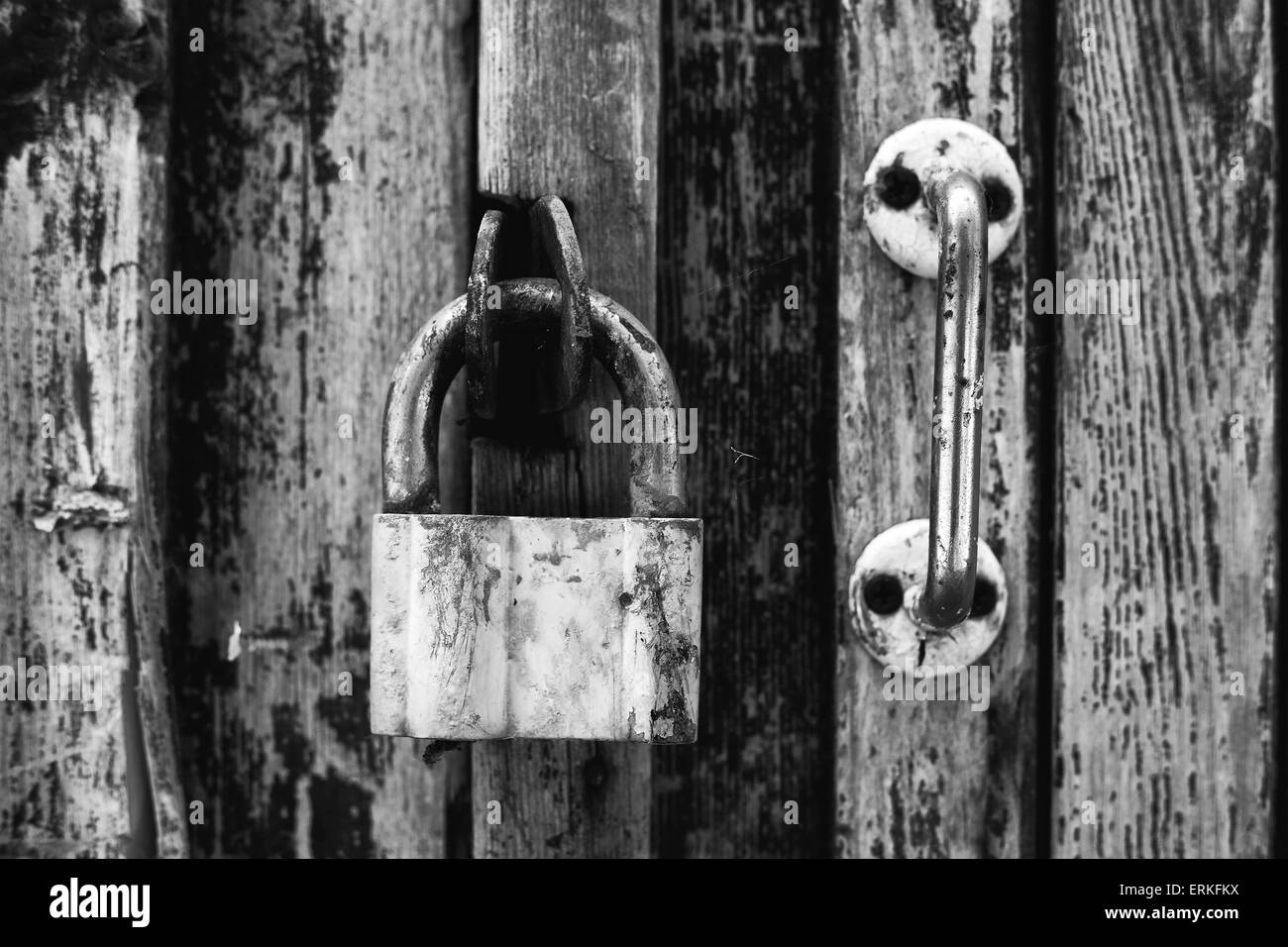 The rusty old lock and the door handle on a wood background Stock Photo ...