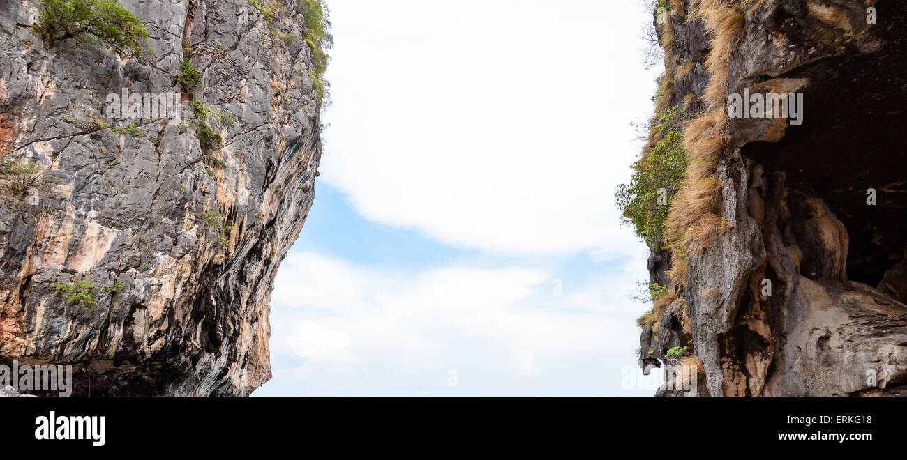 Two stone cliff with a space middle and see the sky Stock Photo