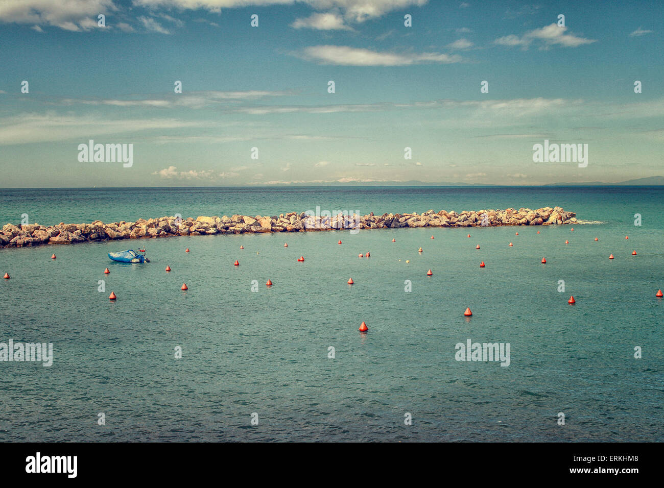 Pier in Mediterranean sea with boat Stock Photo - Alamy