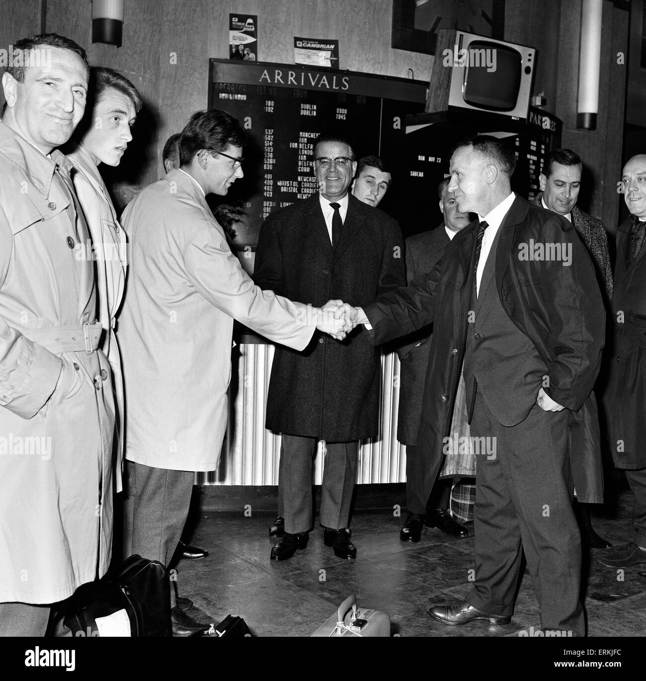 Liverpool manager Bill Shankly greets Jozef Jurion, captain of the Belgian team Anderlecht as they arrive at Speke airport, Liverpool. 23rd November 1964. Stock Photo