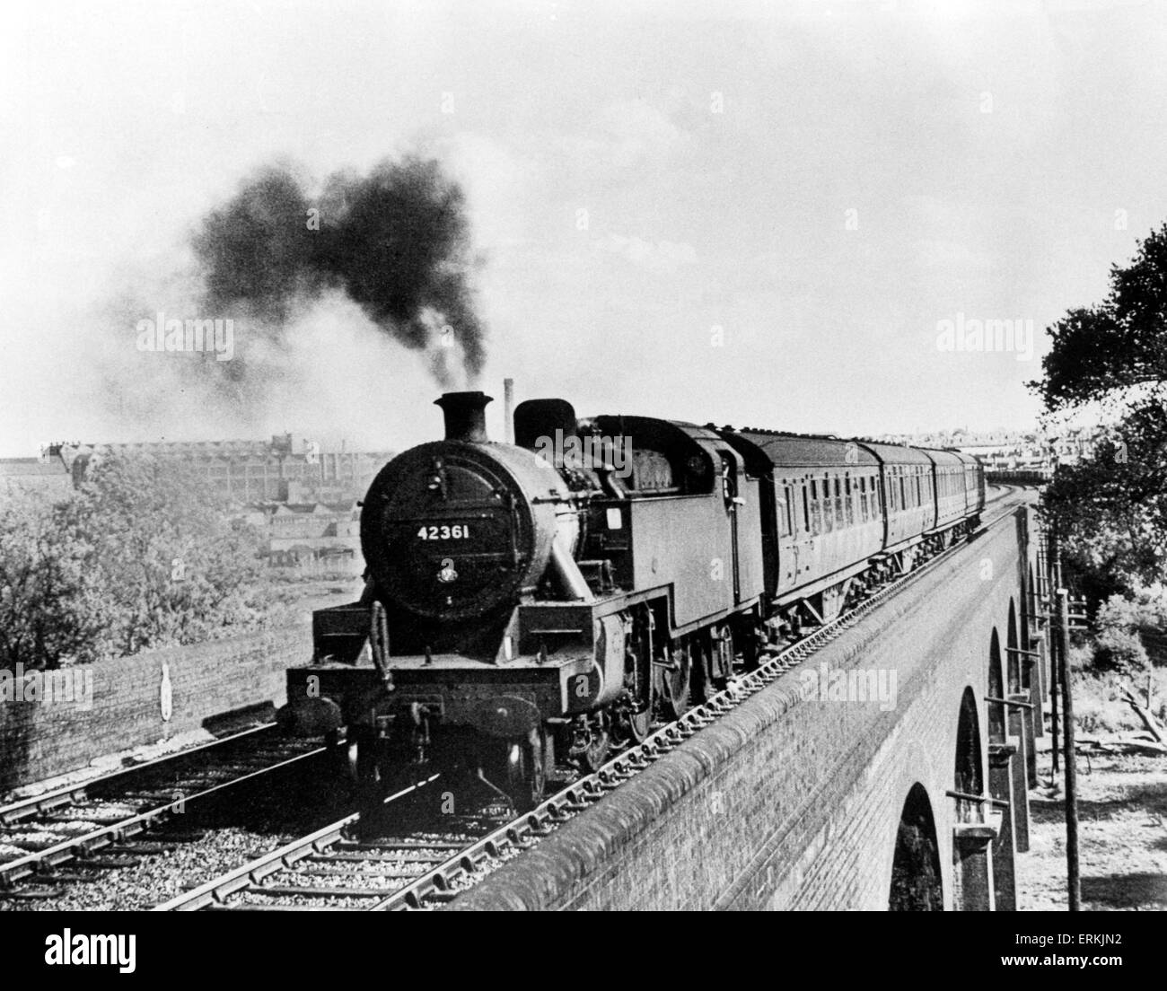 A Leicester based tank engine headed for its home city over the viaduct at Rugby, circa 1964. Stock Photo