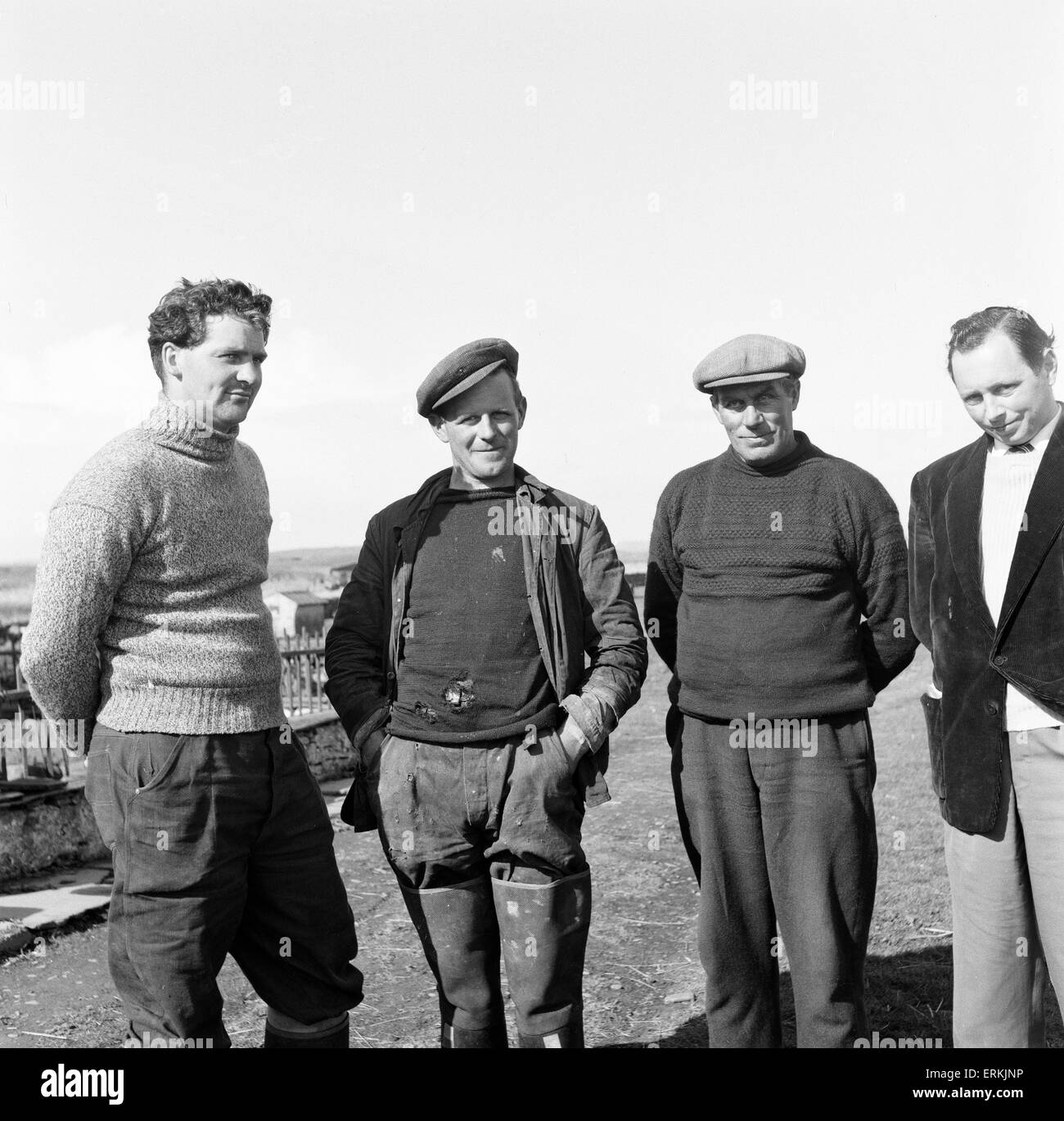 Jamie Rosie, (2nd right), brother of Violet Rosie, a.k.a. The Silent Woman of Swona in the Pentland Firth off the north coast of Scotland. 18th May 1957. Jamie Rosie pictured with lobster fisherman from the neighbouring island of South Ronaldsay. Stock Photo