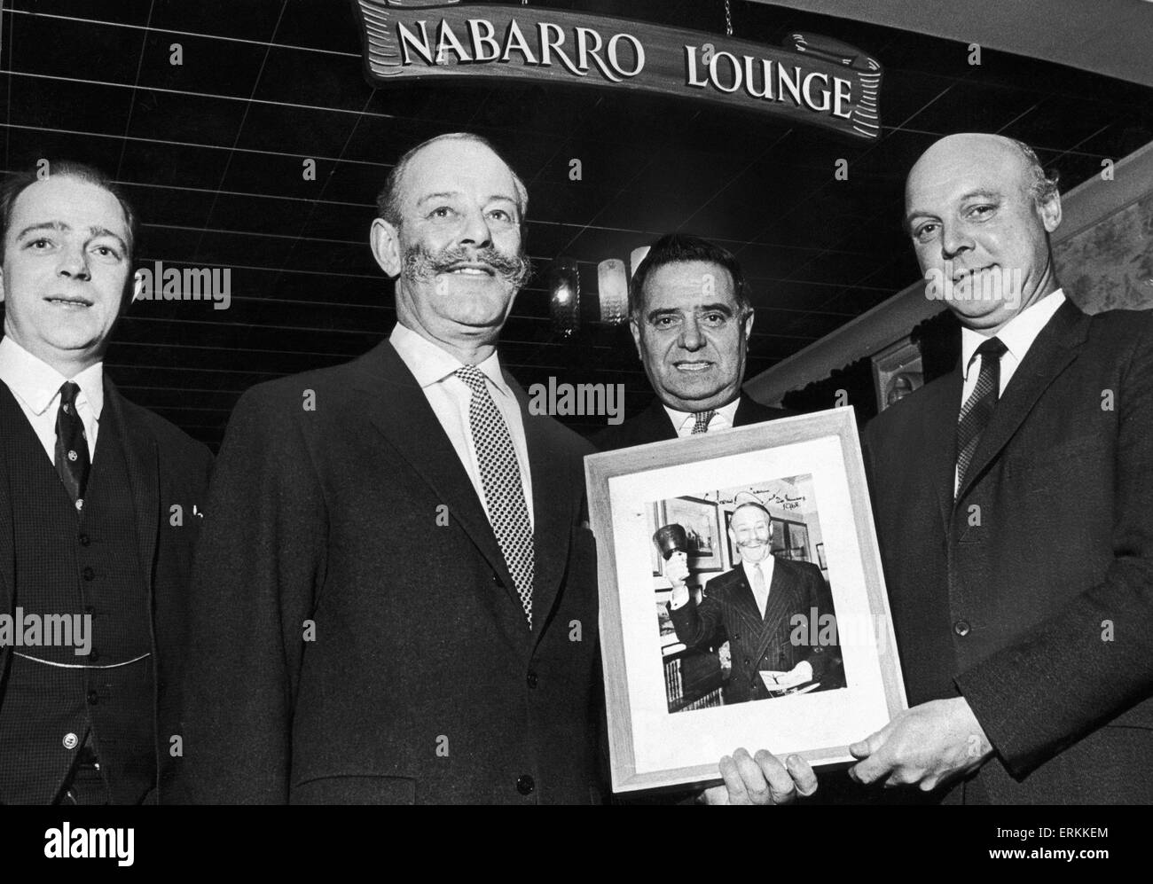 Sir Gerald David Nunes Nabarro was a British Conservative Party politician of the 1950s and 1960s. Nabarro had a flamboyant public profile and a reputation for taking maverick political stances. (Picture) Sir Gerald Nabarro presenting a framed photograph of himself to Hill & Cakemoor conservative club, Blackheath. Mr T.H Parkes, president is in the centre, and Mr J.L Taylor (Chairman) is on the right. 2nd January 1968 Stock Photo