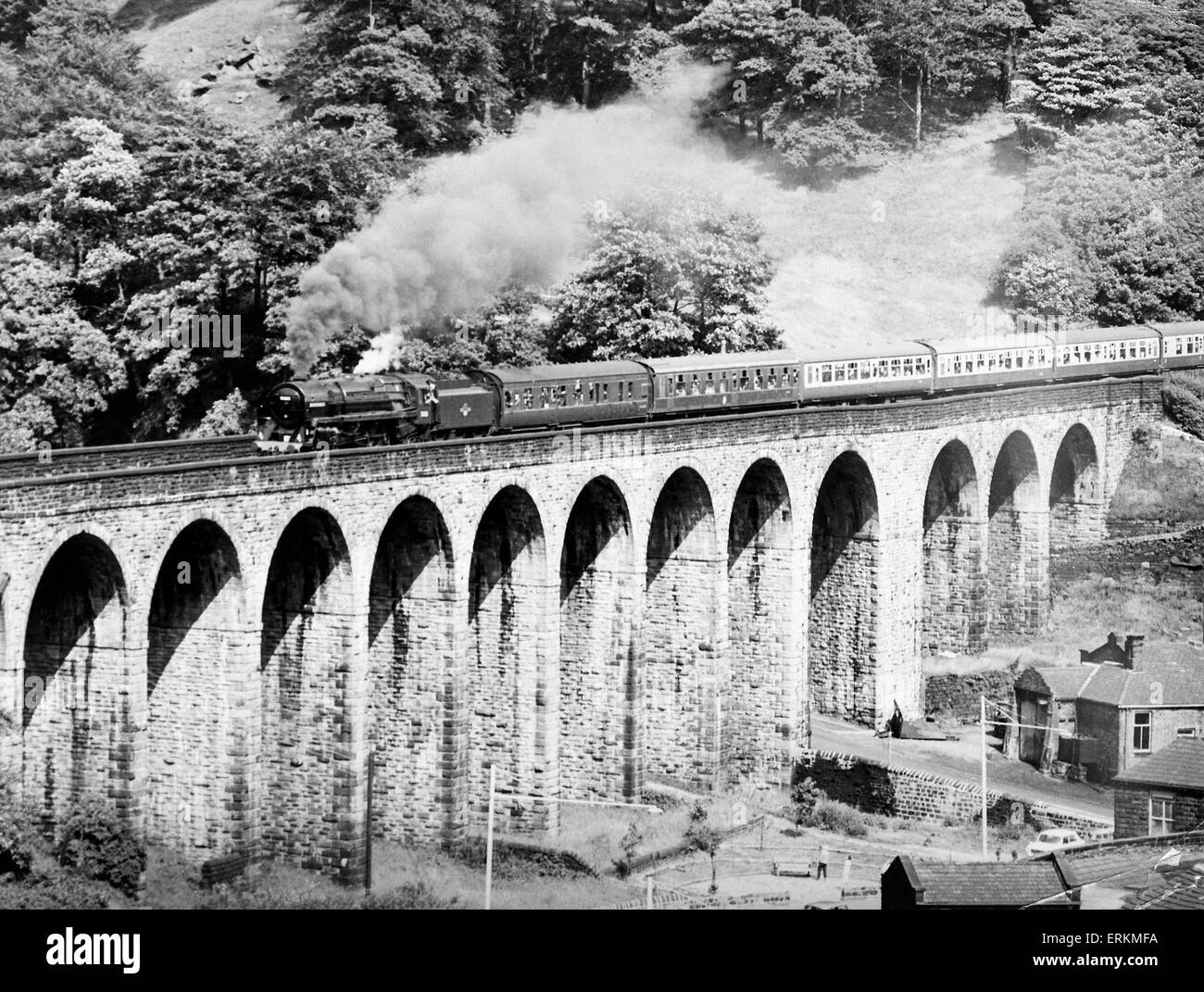 BR standard class 7 steam locomotive 70013 Oliver Cromwell crosses Lydgate viaduct between Todmorden and Burnley with a Roche valley Society special to Southport. 21st July 1968. Stock Photo