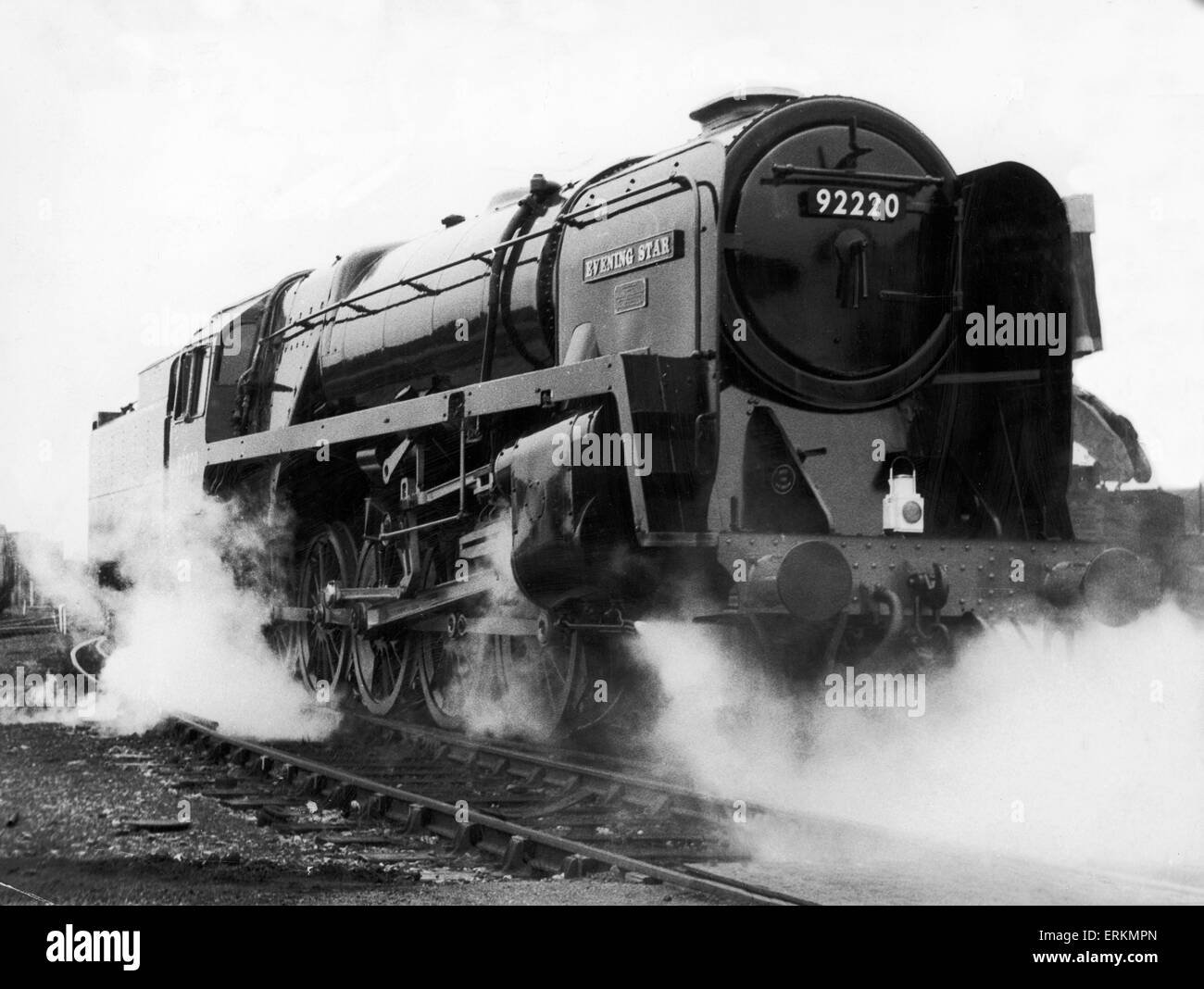 British Railways Standard Class 9F number 92220 Evening Star, the last British rail steam locomotive to be built by British Railways, leaving the sheds after the naming ceremony at Swindon. March 1960. Stock Photo