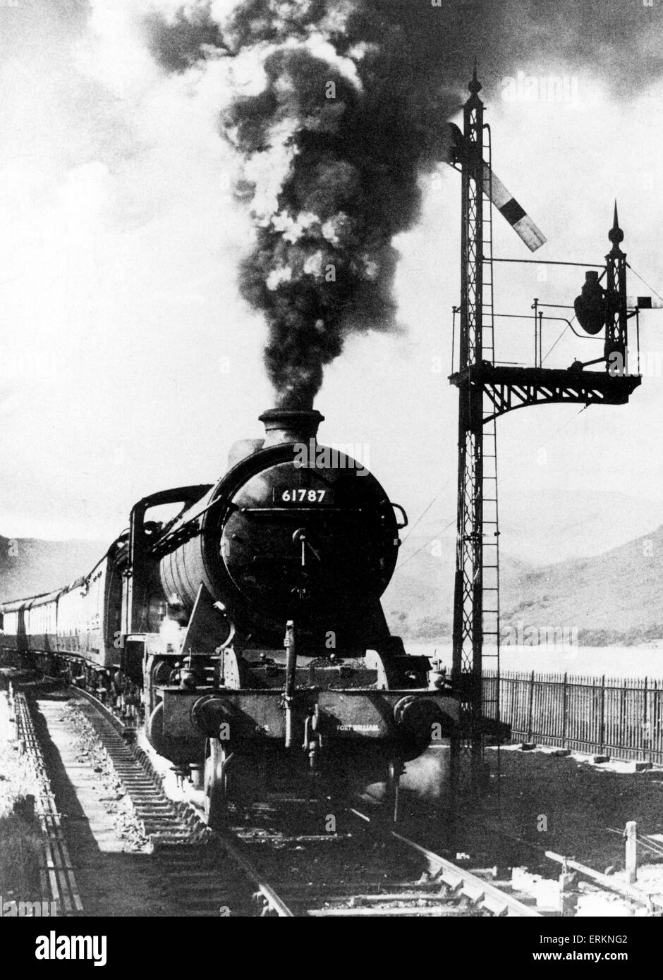 On the former LNER West Highland line, a Class K2 2-6-0 number 61787 steam locomotive Loch Quoich leaves Fort William with a Mallaig train, circa 1952. Stock Photo