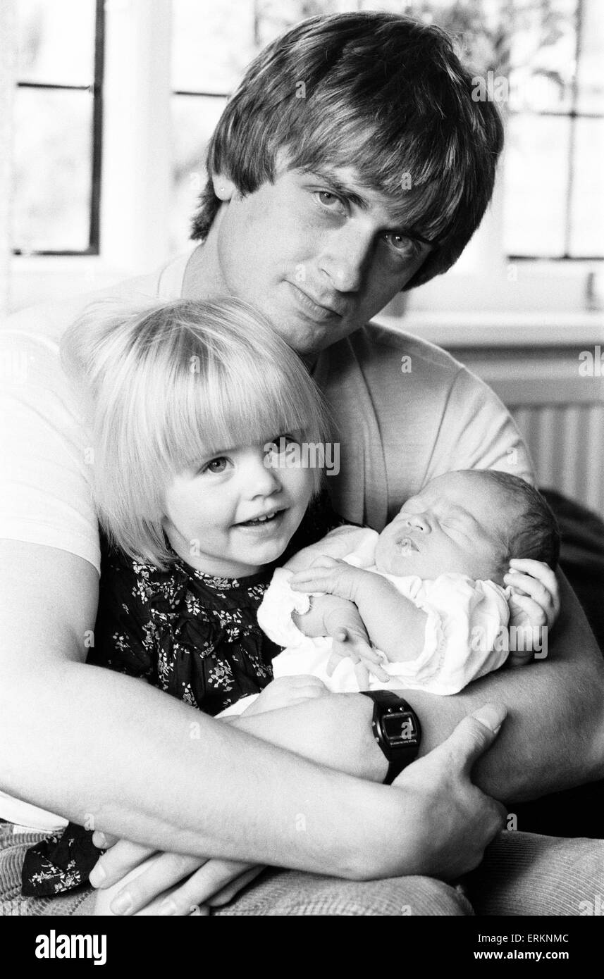 Mike Oldfield, musician and composer, pictured at home with family, eldest daughter Molly and baby son Dougal, Buckinghamshire, September 1981. Stock Photo