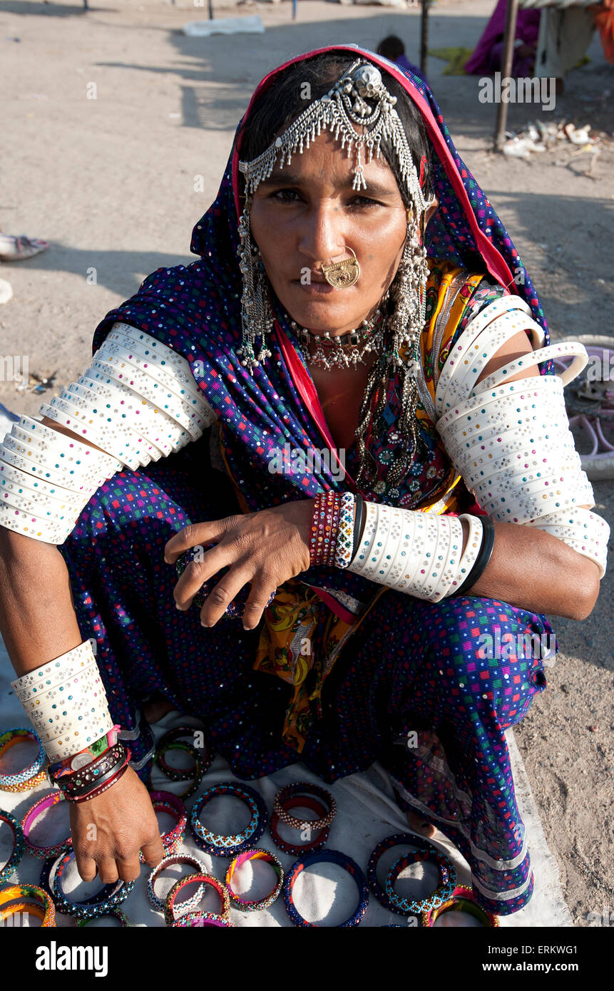 Mir tribeswoman wearing traditional Mir tribal jewellery and married woman's bangles, Dasada, Gujarat, India, Asia Stock Photo
