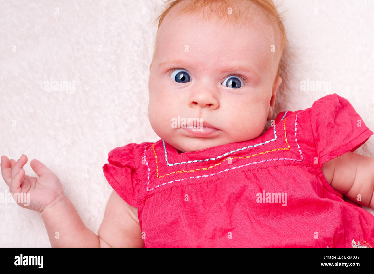 Baby girl in pink dress Stock Photo - Alamy