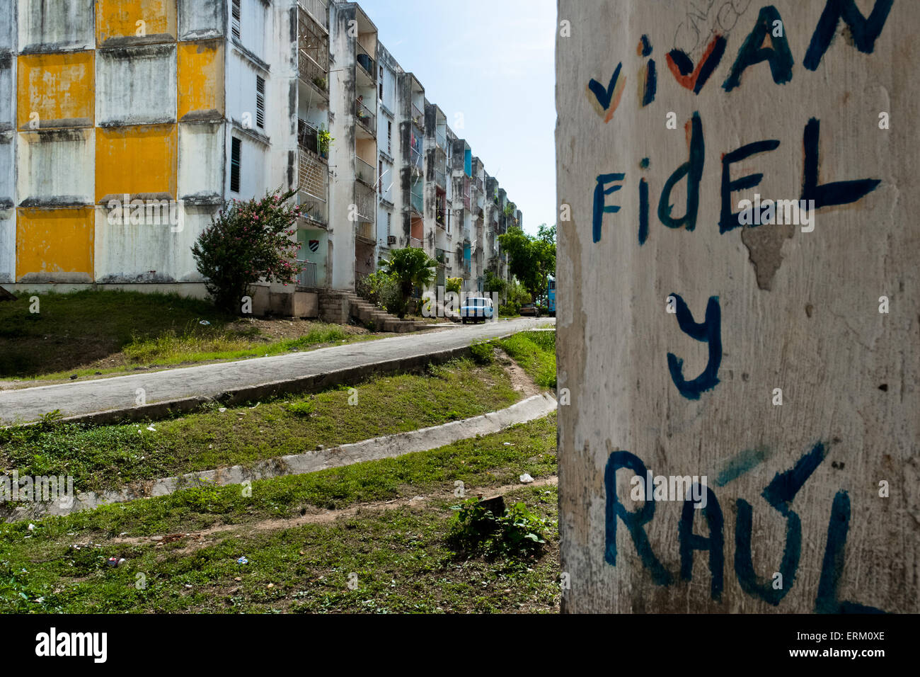 A propaganda writing is seen on the wall in a public housing periphery of Santiago de Cuba, Cuba. Stock Photo