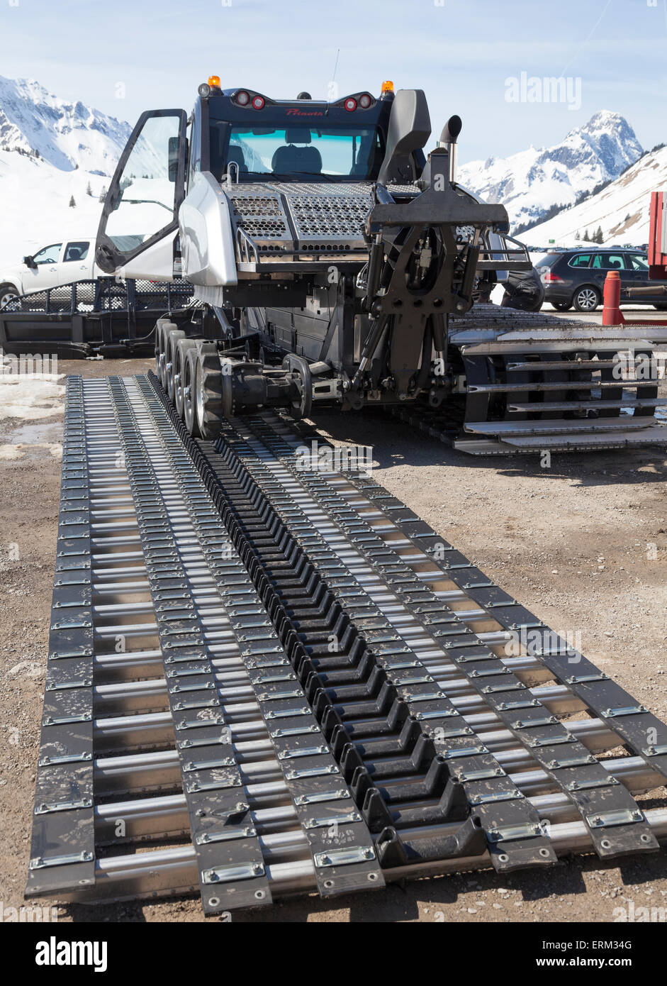 Fitting tracks onto a new snowplow Stock Photo