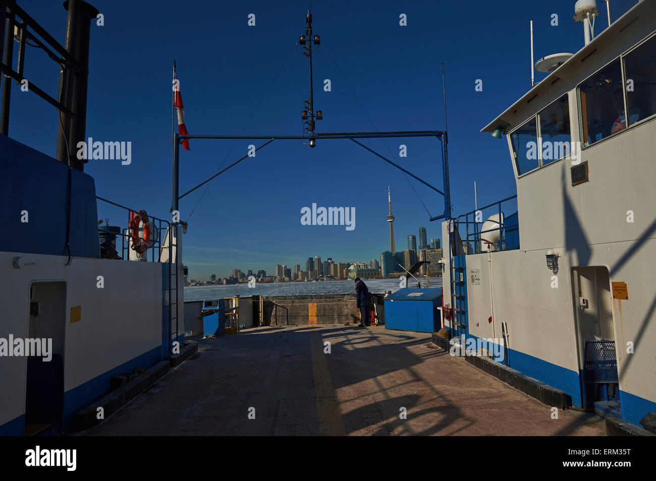 Ferry moving through ice in harbor waterfront; Toronto, Ontario, Canada Stock Photo