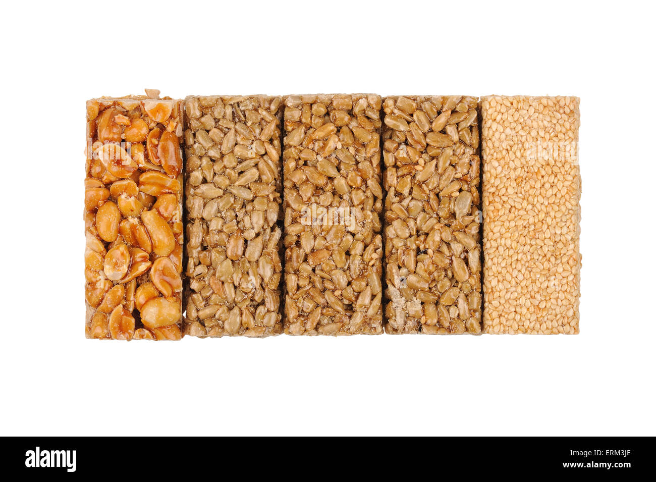 Honey bars with peanuts, sesame and sunflower seeds isolated Stock