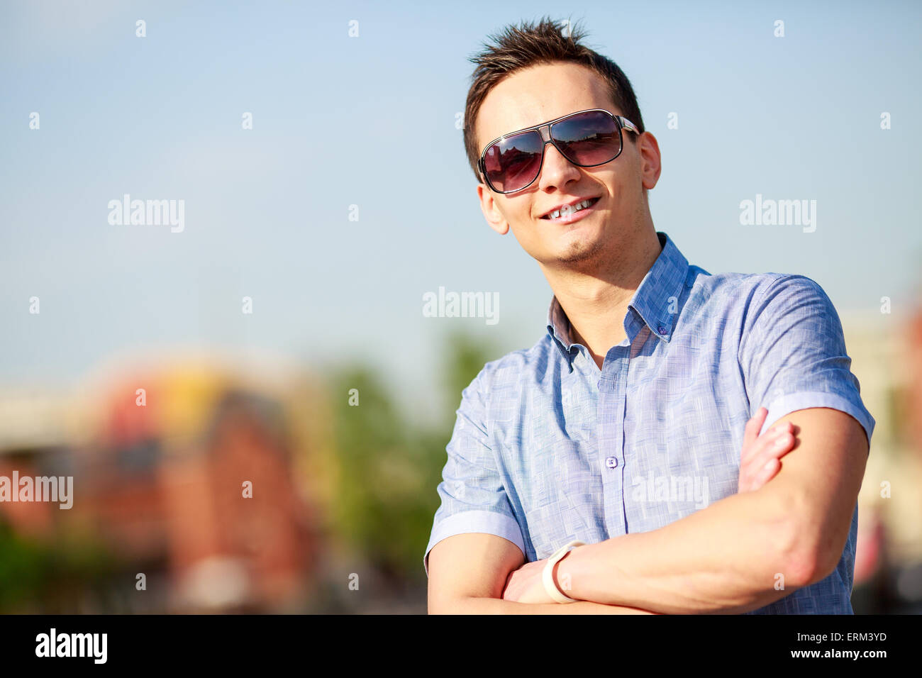 portrait of a trendy young man in the city Stock Photo - Alamy