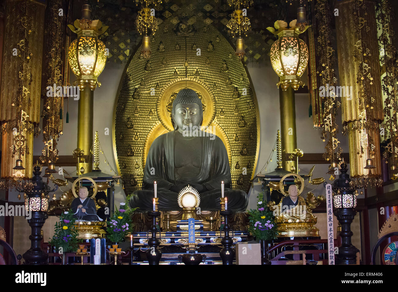 Stone buddha against gold background in a Japanese temple; Uji, Kyoto ...