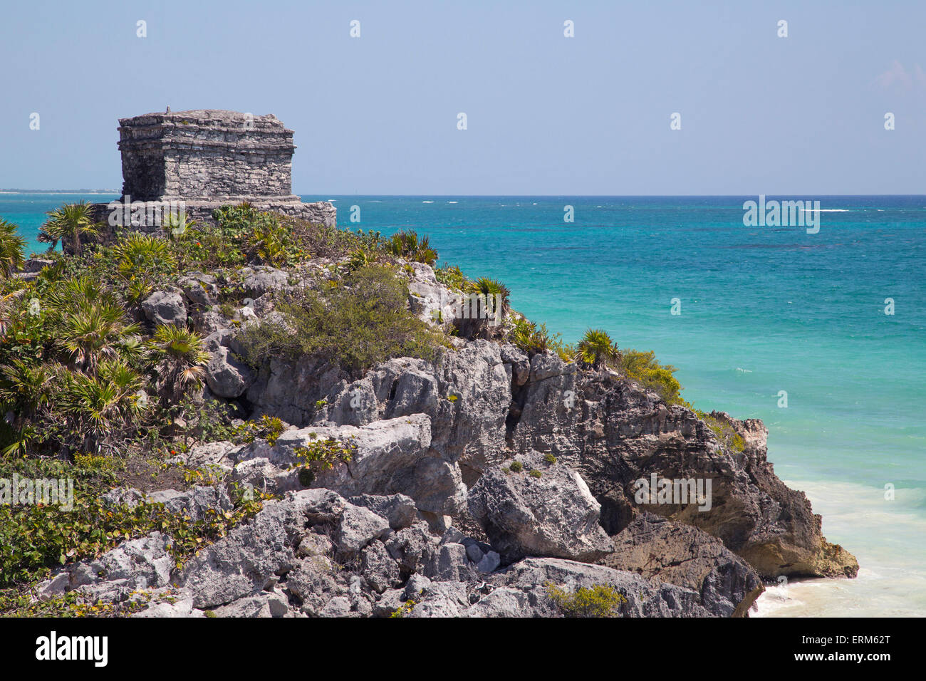 Temple of the Wind, Tulum, in the Mayan Riviera overlooking the aquamarine water of the Caribbean Sea shore, Mexico Stock Photo