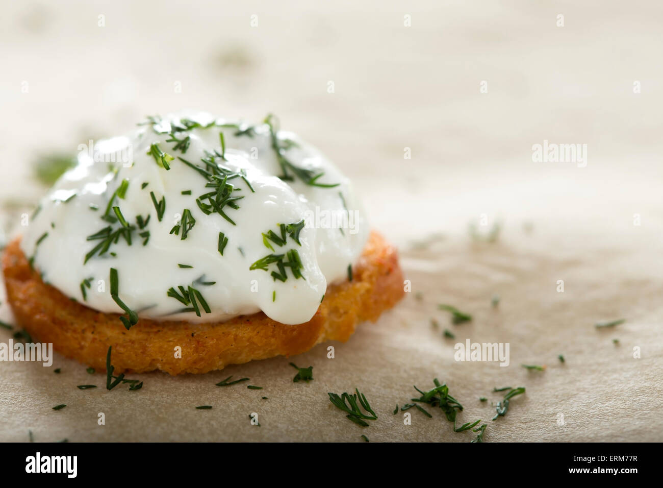 Close up of one fresh cream cheese spread with dill on bake rolls Stock Photo