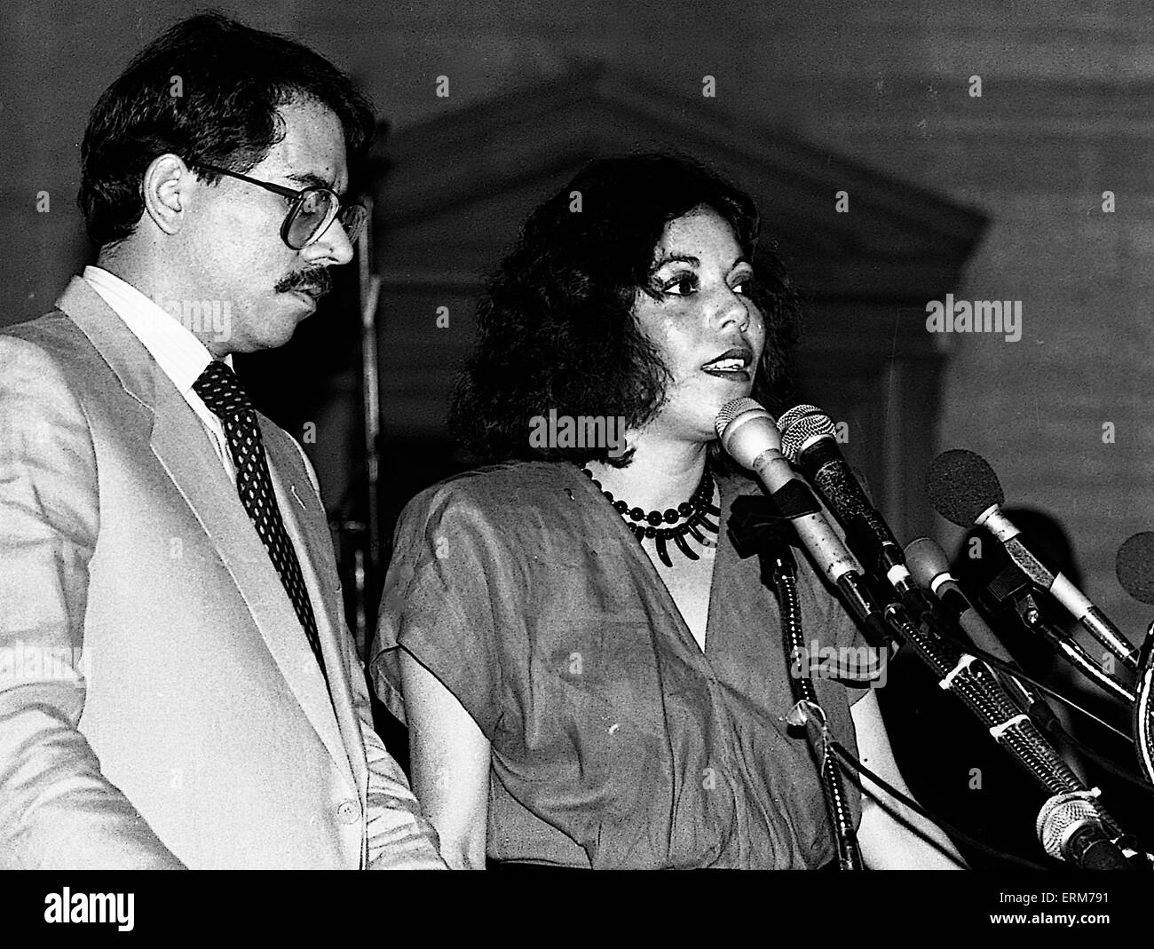 Chicago, Illinois, USA 2nd August 1986 Nicaraguan President Daniel Ortega speaks to the crowd gathered at Operation  Push. His wife Rosario Murillo who is a polyglot translates for him. ``Nicaragua is willing to negotiate with the United States toward a treaty of peace and friendship. We are willing to sign a treaty of peace and friendship with the United States immediately.`` Ortega also invited Reagan to visit Nicaragua and meet with top officials as well as the Nicaraguan people.  Credit:Mark Reintein Stock Photo