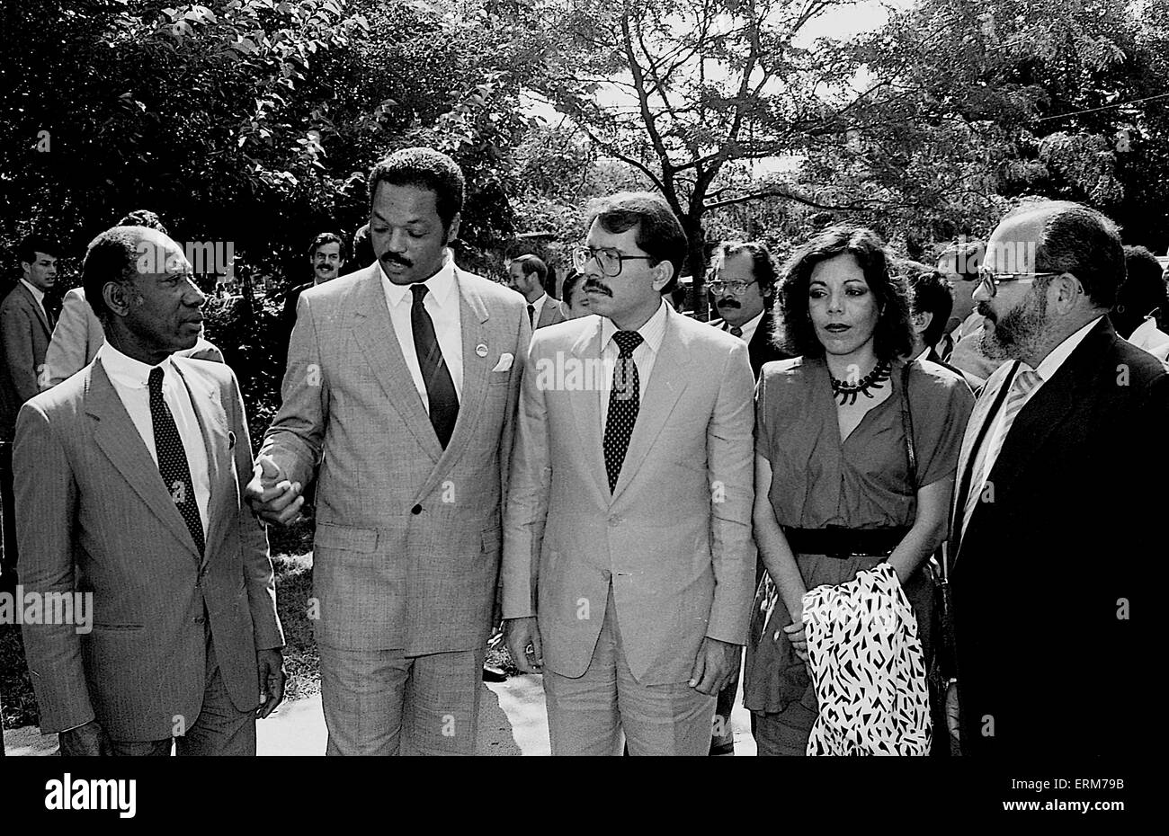 Chicago, Illinois, USA  2nd August 1986 Nicaraguan President Daniel Ortega his wife Rosario  Murillo  with the Rev. Jesse Jackson outside  Operation  Push headquarters. The Nicaraguan FIrst Lady  Rosario Murillo who is a polyglot translates for him. ``Nicaragua is willing to negotiate with the United States toward a treaty of peace and friendship. We are willing to sign a treaty of peace and friendship with the United States immediately.`` Ortega also invited Reagan to visit Nicaragua and meet with top officials as well as the Nicaraguan people.  Credit: Mark Reinstein Stock Photo