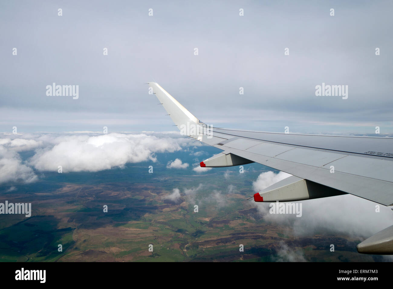 Arrival at London Heathrow airport a view through the window flying wing fields clouds Stock Photo