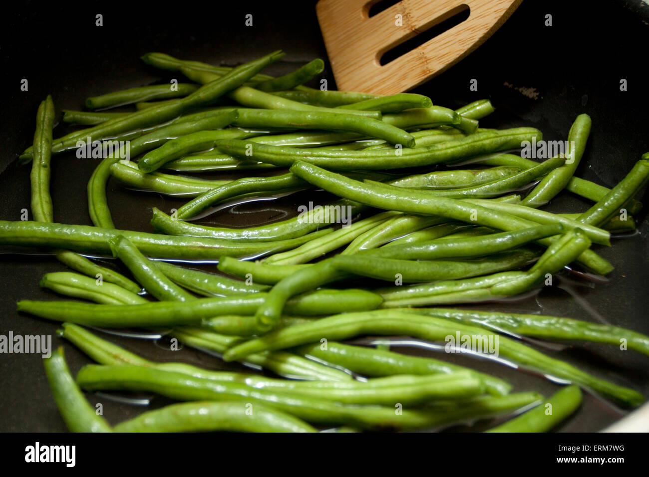 Prepping Ingredients - Sautéing green beans Stock Photo