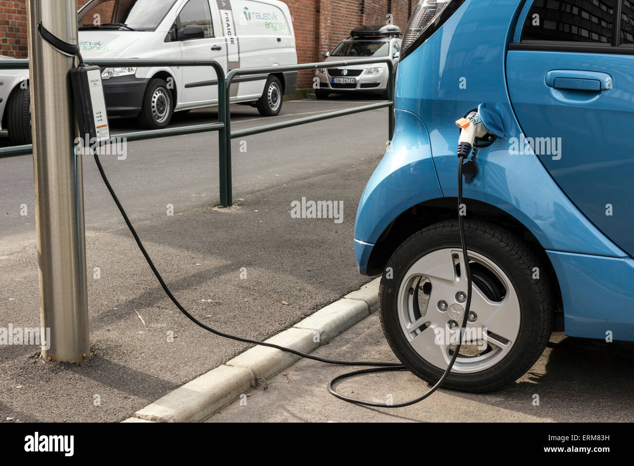 Electric car at charging station at Aker Brygge in Oslo, Norway Stock