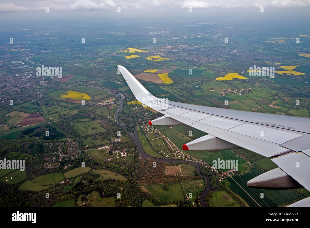 Arrival at London Heathrow airport a view through the window flying wing fields Stock Photo