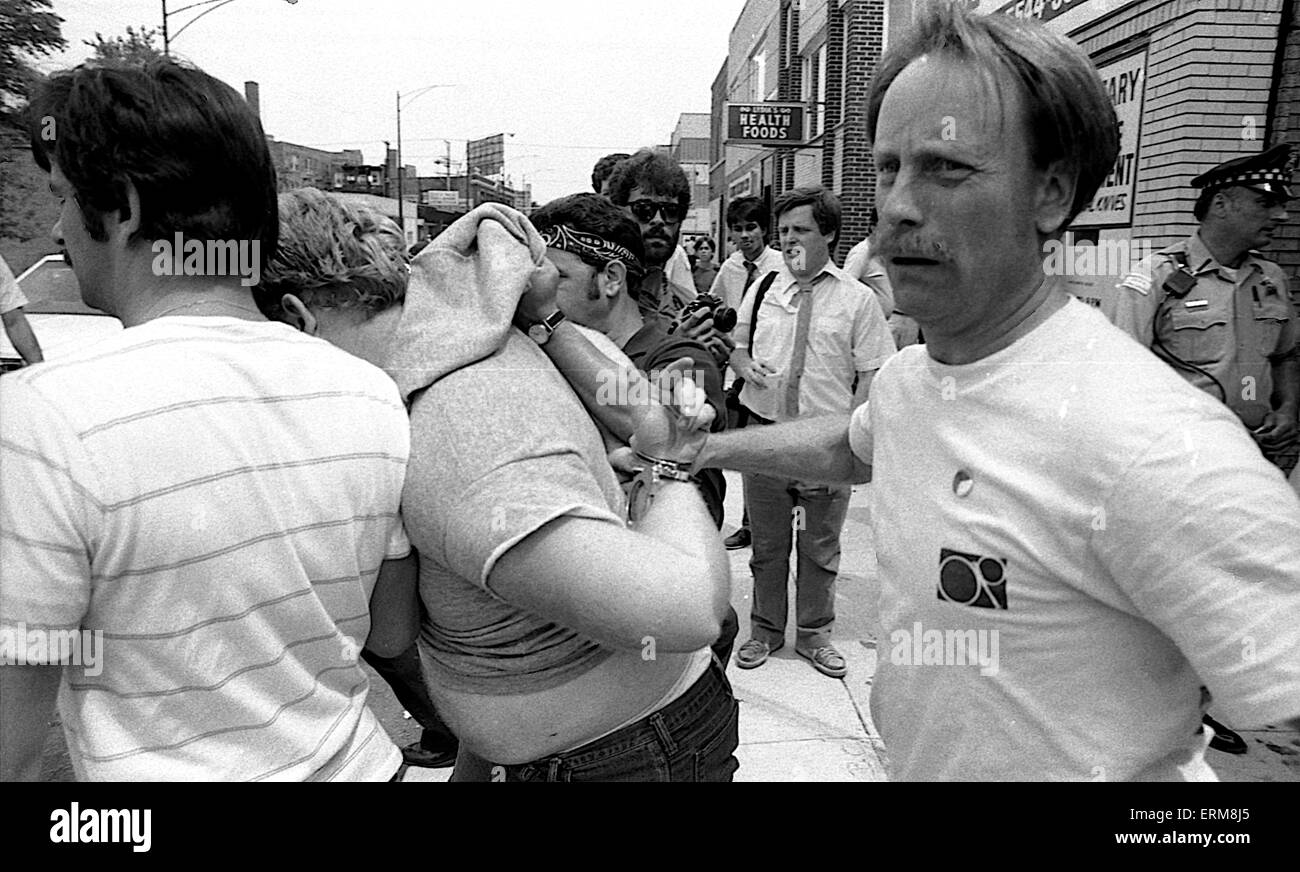 Chicago, Illinois, USA 28th June 1986 Members of the Chicago police tactical squad arrest man in bar and then take him to paddy wagon during KKK rally in the Marquette Park area. Credit: Mark Reinstein Stock Photo