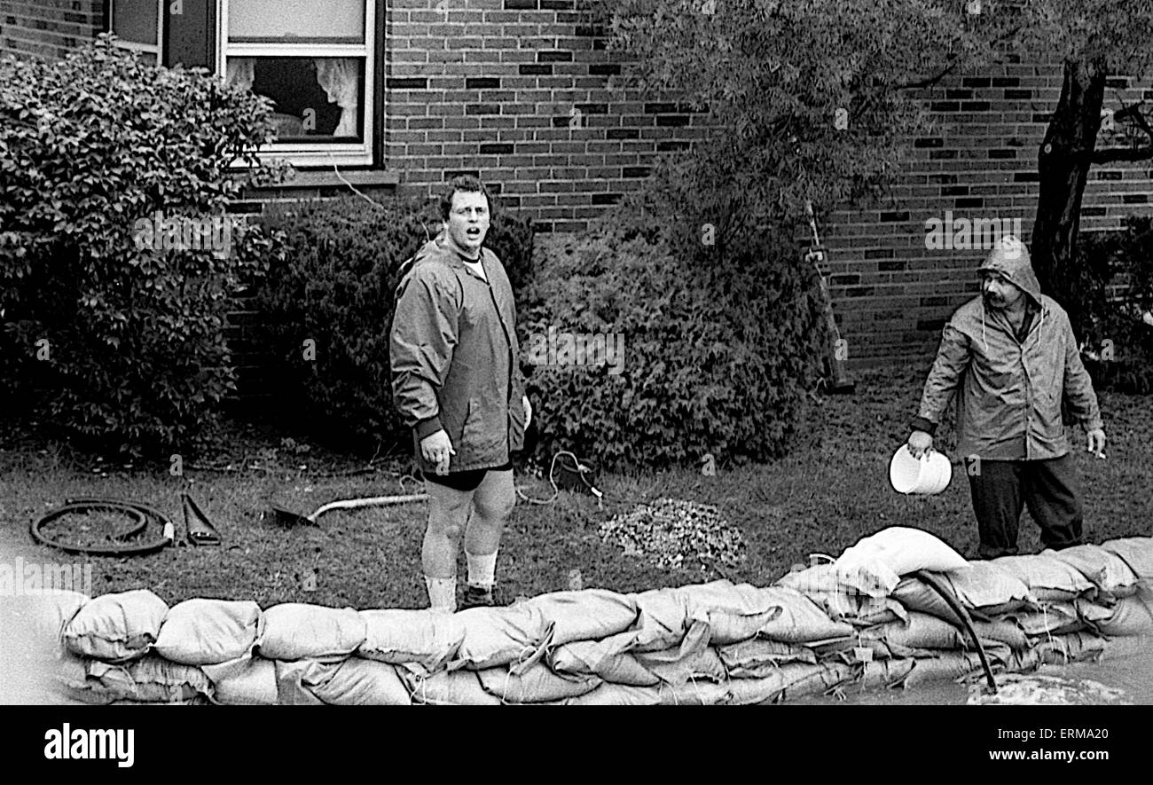 Residents of Mount Prospect, Illinois use sandbags to block flood
