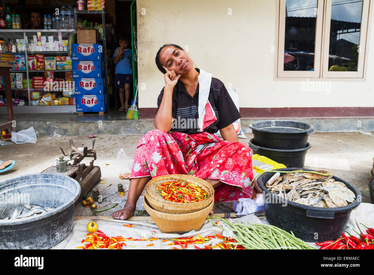 Woman selling hot peppers at the weekly market, Semparu, Lombok, West Nusa Tenggara, Indonesia Stock Photo