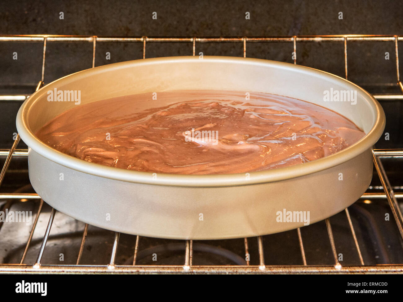 Part one in a series showing how cake batter rises when it cooks.  See also image number ERMCDE Stock Photo