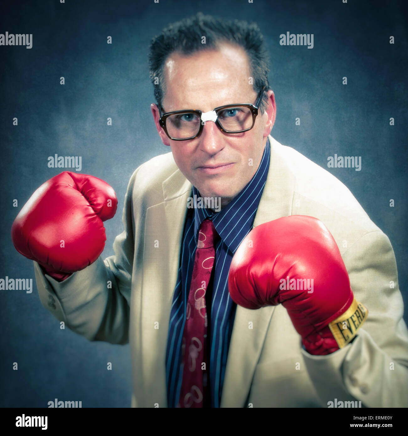 Business man with broken glasses with red boxing gloves Stock Photo - Alamy