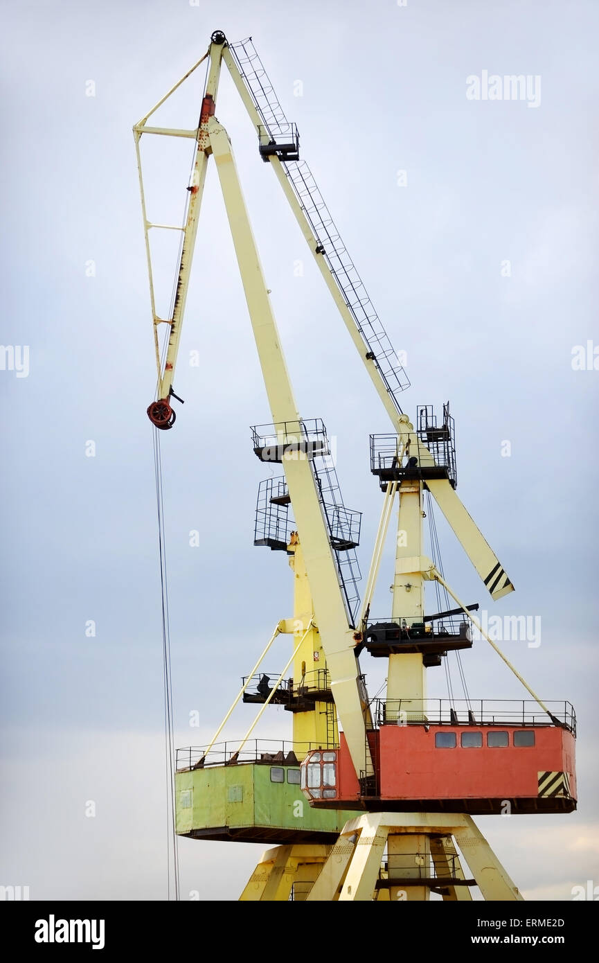 Industrial shipping cranes for containers in a port Stock Photo